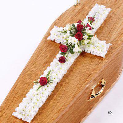 <h2>Large Classic Cross-Shaped Design in White and Red | Funeral Flowers</h2>
<ul>
<li>Approximate Size W 45cm H 130cm</li>
<li>Hand created large classic white and red cross in fresh flowers</li>
<li>To give you the best we may occasionally need to make substitutes</li>
<li>Funeral Flowers will be delivered at least 2 hours before the funeral</li>
<li>For delivery area coverage see below</li>
</ul>
<br>
<h2>Liverpool Flower Delivery</h2>
<p>We have a wide selection of Funeral Crosses offered for Liverpool Flower Delivery. Funeral Crosses can be provided for you in Liverpool, Merseyside and we can organize Funeral flower deliveries for you nationwide. Funeral Flowers can be delivered to the Funeral directors or a house address. They can not be delivered to the crematorium or the church.</p>
<br>
<h2>Flower Delivery Coverage</h2>
<p>Our shop delivers funeral flowers to the following Liverpool postcodes L1 L2 L3 L4 L5 L6 L7 L8 L11 L12 L13 L14 L15 L16 L17 L18 L19 L24 L25 L26 L27 L36 L70 If your order is for an area outside of these we can organise delivery for you through our network of florists. We will ask them to make as close as possible to the image but because of the difference in stock and sundry items it may not be exact.</p>
<br>
<h2>Liverpool Funeral Flowers | Crosses</h2>
<p>This large classic funeral cross has been loving handcrafted by our expert florists and features a mass of white spray chrysanthemums, together with a spray of red roses and white freesia and luscious green foliage completes this traditional design.</p>
<br>
<p>Funeral crosses are symbols of belief they reaffirm faith and provide comfort at this difficult time.</p>
<p><br />In the larger sizes (from 4ft up) they are appropriate as the main tribute but smaller sizes are sometimes chosen by close friends as they represent extremely personal sentiments and feelings.</p>
<br>
<p>Containing 35 white double spray chrysanthemums, 8 red large-headed roses, 10 white freesia and seasonal mixed foliage.</p>
<br>
<h2>Best Florist in Liverpool</h2>
<p>Trust Award-winning Liverpool Florist, Booker Flowers and Gifts, to deliver funeral flowers fitting for the occasion delivered in Liverpool, Merseyside and beyond. Our funeral flowers are handcrafted by our team of professional fully qualified who not only lovingly hand make our designs but hand-deliver them, ensuring all our customers are delighted with their flowers. Booker Flowers and Gifts your local Liverpool Flower shop.</p>
<br>
<p><em>Janice Crane - 5 Star Review on Google - Funeral Florist Liverpool</em></p>
<br>
<p><em>I recently had to order a floral tribute for my sister in laws funeral and the Booker Flowers team created a beautifully stunning arrangement. Thank you all so much, Janice Crane.</em></p>